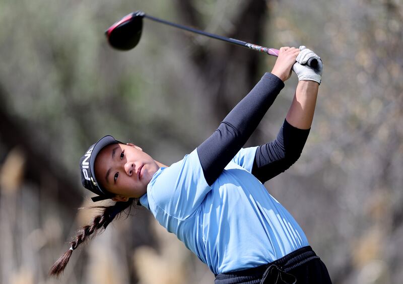 Skyline’s Ashley Lam tees off as she and other girls compete in the 5A golf championship at River Oaks Golf Course in 2022.