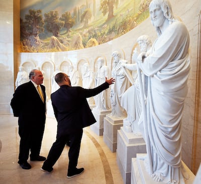 Elder Ronald A. Rasband, left, of the Quorum of the Twelve Apostles of The Church of Jesus Christ of Latter-day Saints, talks with Pastor Chris Zacharias of the John Wesley A.M.E. Zion Church as they tour the Rome Temple Visitors' Center on Tuesday, Jan.