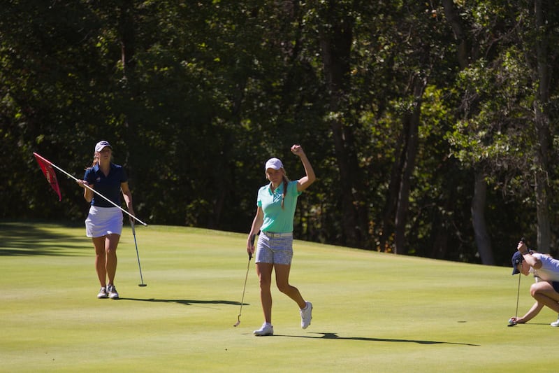 Utah Valley senior Kimberly Nyhus raises her arm in celebration after sinking a putt at the Hobble Creek Fall Classic last month. Nyhus and the Wolverines head to Lakewood, Washington, this weekend to take part in Seattle U's Pat Lesser Harbottle Invitati
