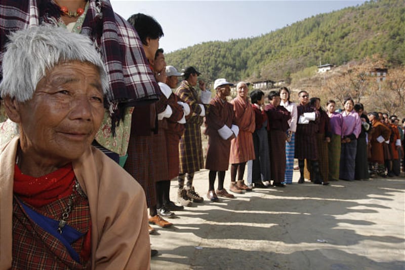 Bhutanese wait in line to cast ballots on Monday in Thimphu, Bhutan. The victor, Jigmi Kinley, is celebrating his landslide — his party took 44 of the 47 parliament seats. Spokesman Palden Tshering called the win a "victory for His Majesty."