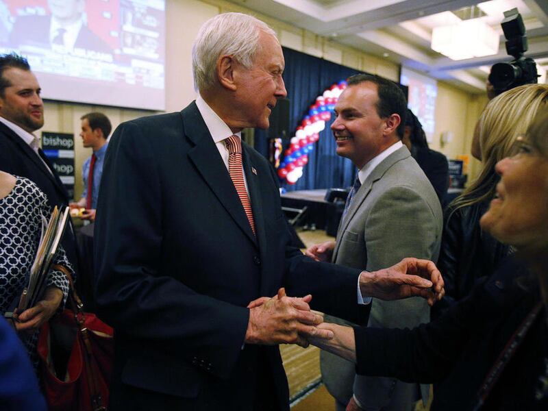 FILE - Sen. Orrin Hatch, R-Utah, and Sen. Mike Lee, R-Utah greet on election night in Salt Lake City, Tuesday, Nov. 4, 2014.