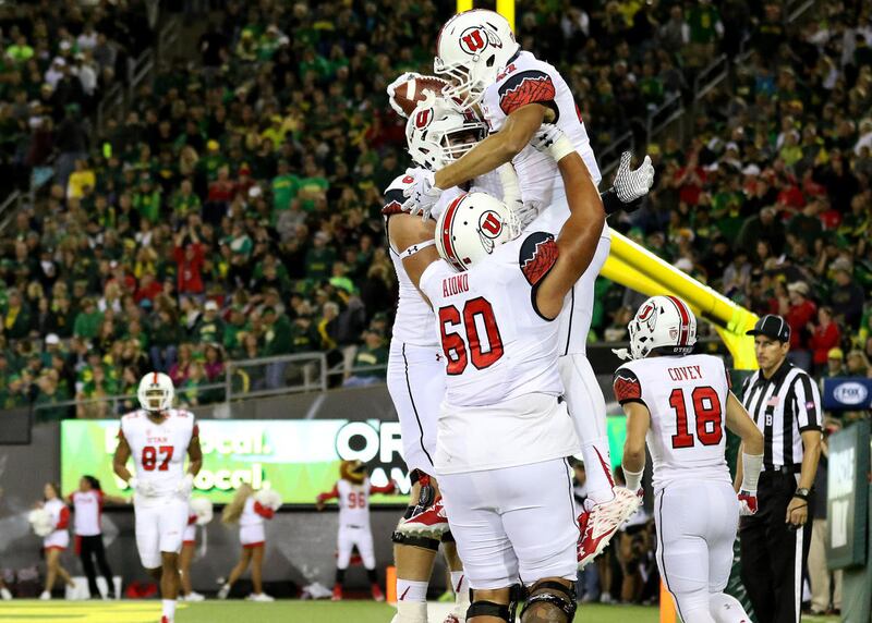Utah tight end Caleb Repp (47) celebrates with teammates after scoring a touchdown during the second half of an NCAA college football game against Oregon, Saturday, Sept. 26, 2015, in Eugene, Ore. (AP Photo/Ryan Kang)