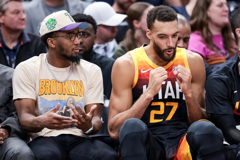 Utah Jazz guard Donovan Mitchell sits with center Rudy Gobert (27) during agame against the LA Clippers at Vivint Arena in Salt Lake City on Friday, March 18, 2022.