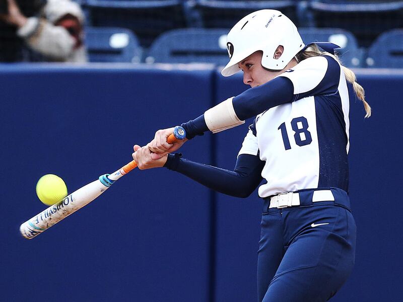 BYU's Caitlyn Alldredge hits the ball as they and UVU compete in softball action at BYU in Provo on Wednesday, April 26, 2017.