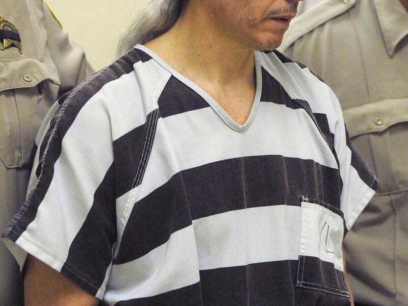 FILE - In this April 13, 2011, file photo Rodney Berget, accused of killing a South Dakota prison guard during an unsuccessful escape in 2011, is escorted to court in Sioux Falls, SD. A pre-trial hearing that is expected to last all week began Monday, Jan