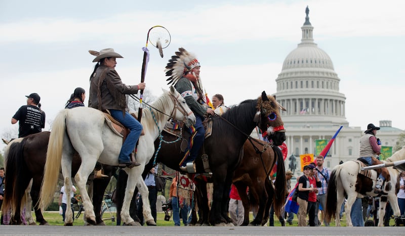 Shane Red Hawk of the Sioux Tribe rides a horse alongside others protesting the Keystone XL pipeline in April 2014.