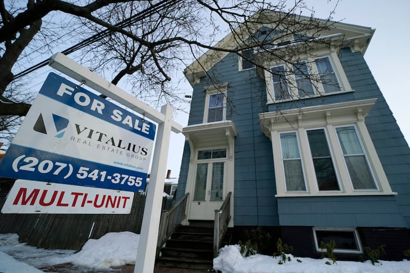 A sign announces a home for sale on Munjoy Hill in Portland, Maine.