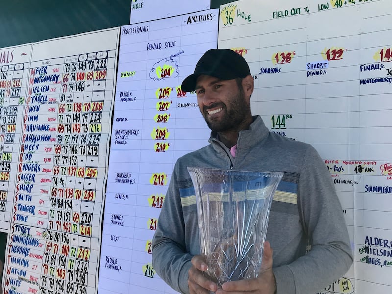 Park City's Steele DeWald holds the trophy after winning the 80th annual Provo Open with a three-day score of 12-under 204 at East Bay golf course, Saturday, June 8, 2019 in Provo, Utah.