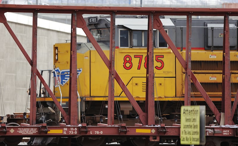 An engine pulls cars at the Union Pacific Roper yard.