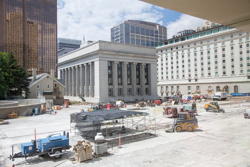 Damaged concrete is removed to prepare for grout to repair the concrete surface of the Church Office Building plaza.