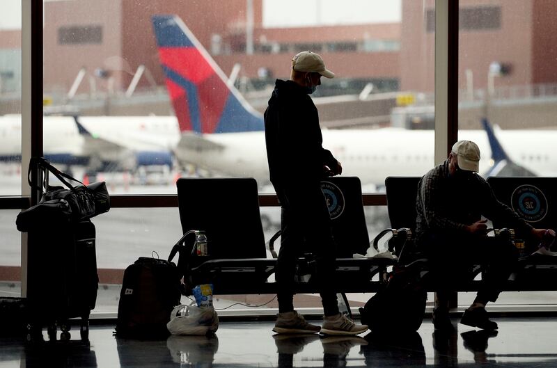 People wait inside the Salt Lake City International Airport on Thursday, March 11, 2021. Nancy Volmer, the airport’s director of communication and marketing, reported international, nonstop travel is set to reopen this summer.