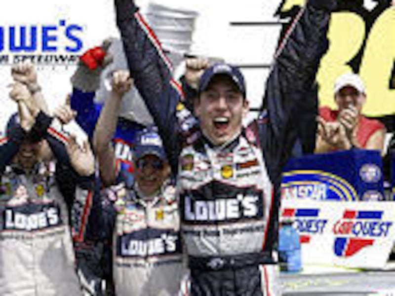Kyle Busch celebrates in victory lane after winning the NASCAR Busch Series Carquest Auto Parts 300 at Lowe's Motor Speedway Saturday.