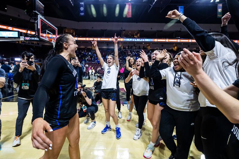 BYU players celebrate beating San Francisco in the West Coast Conference tournament quarterfinals.