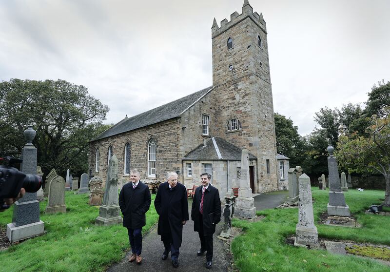 President M. Russell Ballard of The Church of Jesus Christ of Latter-day Saints, center, his son Craig Ballard, left, and Elder Massimo De Feo, Area President