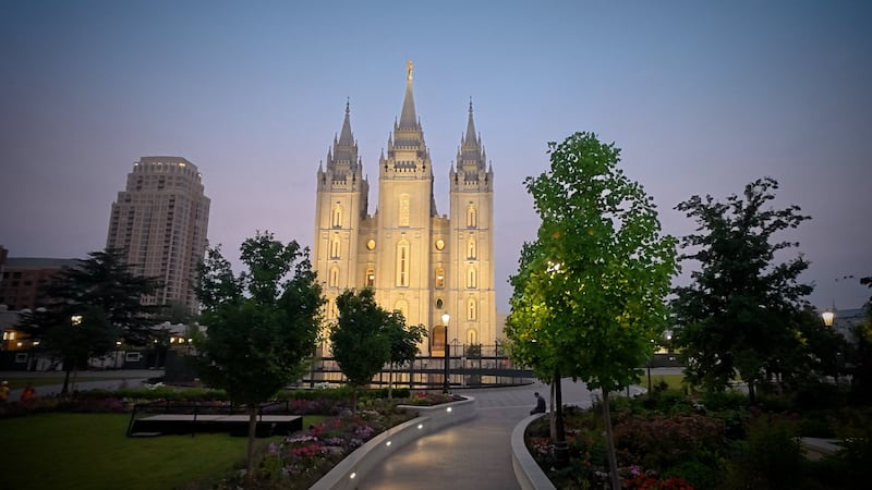 Just after sunrise on Tuesday, June 23, 2026, workers placed the renovated wooden doors back in their respective arches on the east side of the Salt Lake Temple.