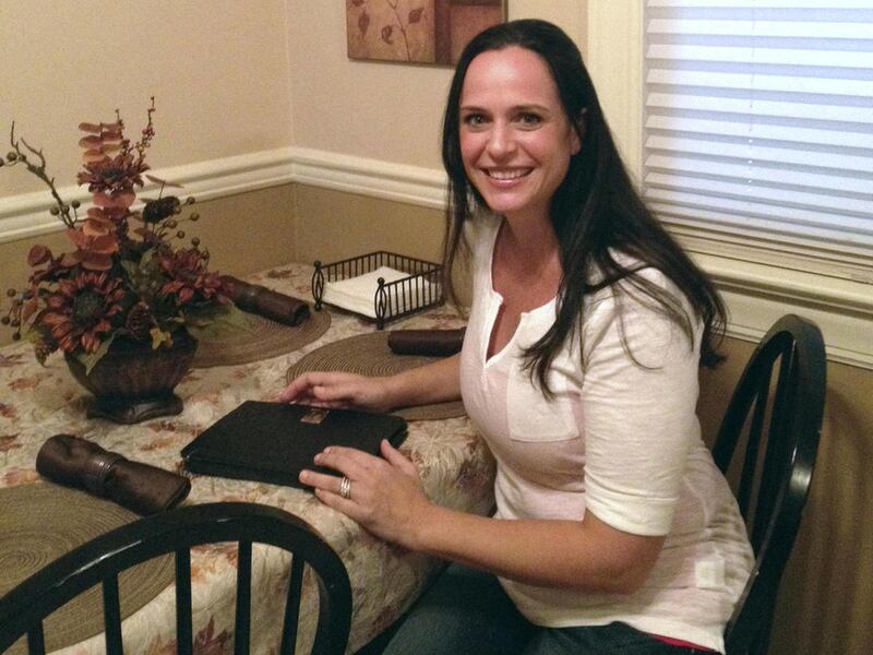 Maryann Sahoury poses for a photo at her home in Wood Ridge, N.J. on Thursday, Aug. 9, 2012. Sahoury is suing a production company after an instructional breast-feeding video she appeared in was taken by a third party and used to create pornography.