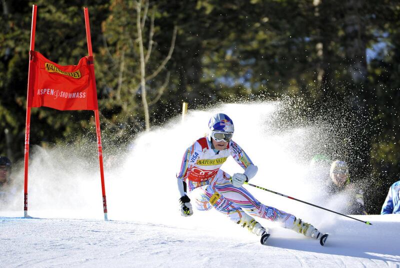 Lindsey Vonn rounds a gate on the upper part of the course during the first run of the women's World Cup skiing competition, Saturday, Nov. 26, 2011, in Aspen, Colo.