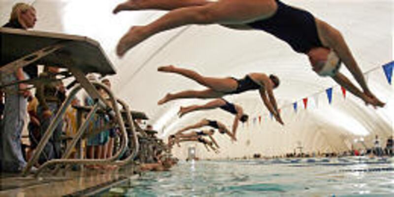 Competitors dive into the swimming pool at the American Fork Fitness Center Jan. 8. The fitness center ran nearly $300,000 in the red last year.
