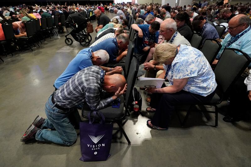 People pray at the Southern Baptist Convention.