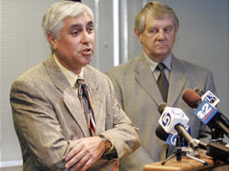 Special prosecutor Michael Martinez talks at a press conference Tuesday. Salt Lake County District Attorney David Yocom looks on.