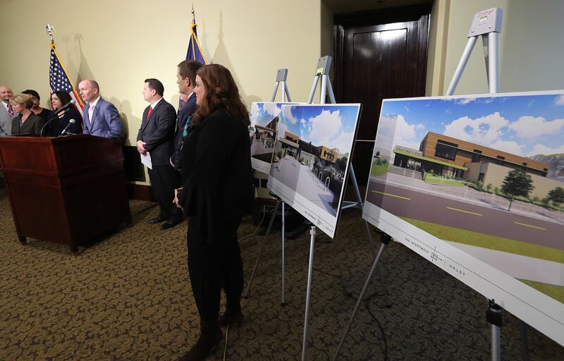 Renderings of the three new homeless resource centers are displayed as Lt. Gov Spencer Cox speaks at the Capitol in Salt Lake City on Wednesday, Jan. 23, 2019, regarding the transition from the downtown homeless shelter to three new centers.