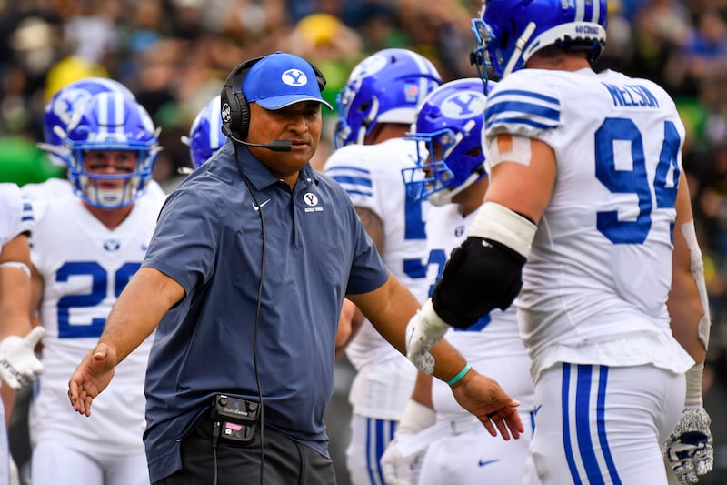 BYU coach Kalani Sitake greets players off the field against Oregon Saturday, Sept. 17, 2022, in Eugene, Ore.