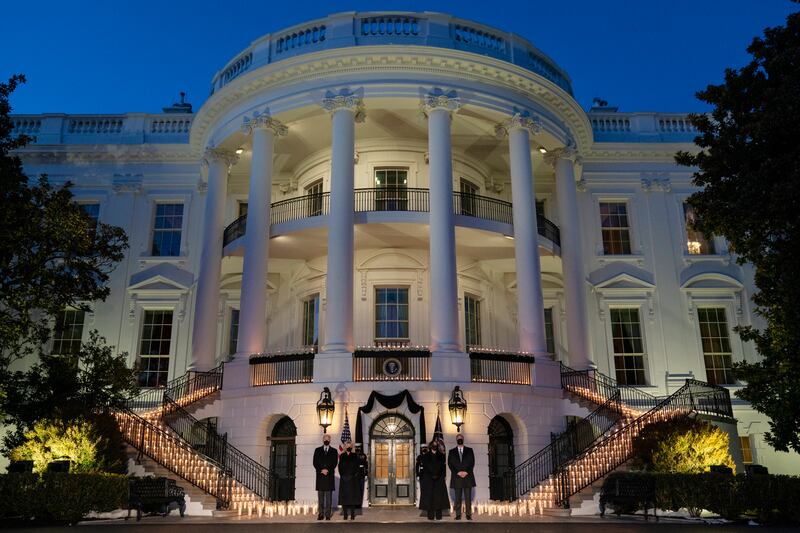 President Joe Biden, first lady Jill Biden, Vice President Kamala Harris, and Doug Emhoff participate in a moment of silence during a ceremony to honor the 500,000 Americans that died from COVID-19 on Feb. 22, 2021.
