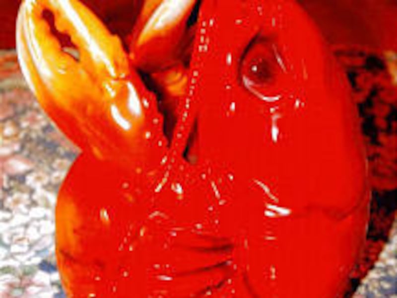 This porcelain lobster, designed to hold tobacco, should be valued between $650 to $750 for insurance replacement purposes.