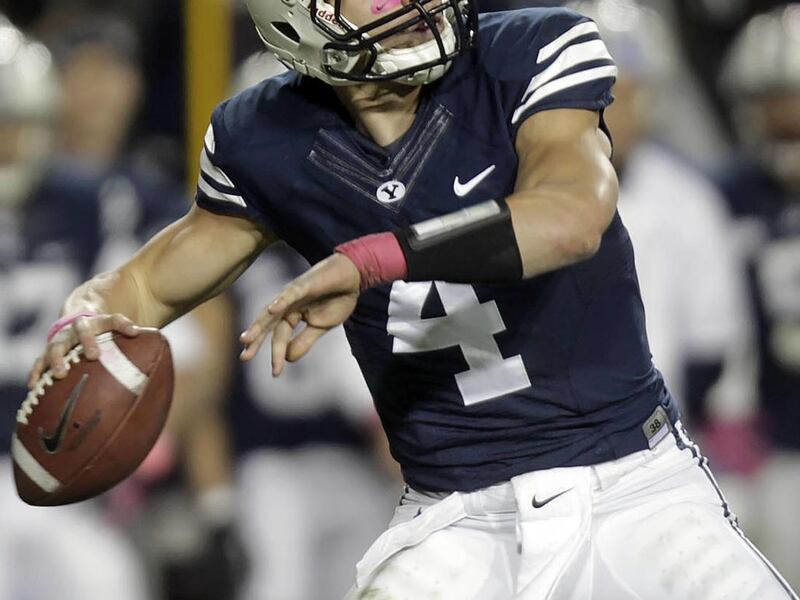 BYU's Quarter back Taysom Hill looks long down field for a pass as BYU and Utah State play Friday, Oct. 5, 2012 at Lavell Edwards Stadium in Provo Utah.