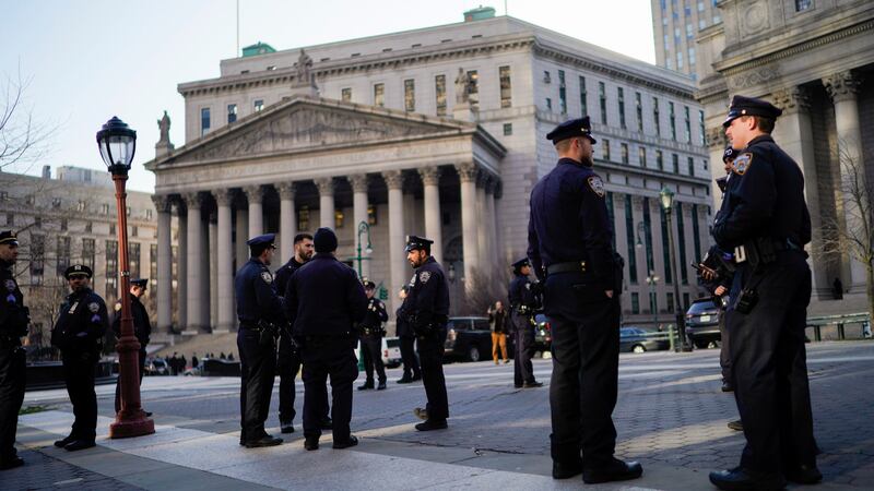 New York Police officers wait for instructions around the courthouse ahead of former President Donald Trump’s anticipated indictment on March 21, 2023, in New York.
