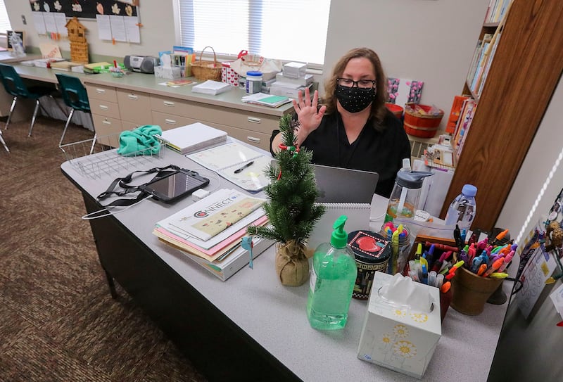 Jody Kyburz waves goodbye to other fifth grade teachers after an online meeting at Snow Springs Elementary School in Lehi.