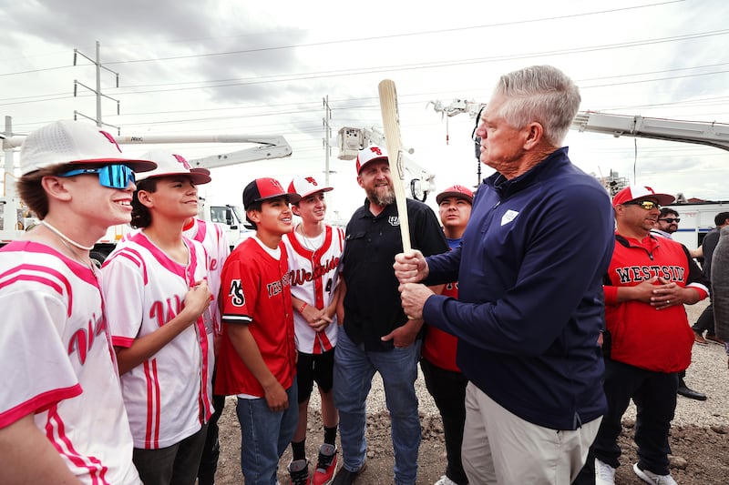 Dale Murphy talks to young baseball players at the groundbreaking of the Power District property in Salt Lake City.