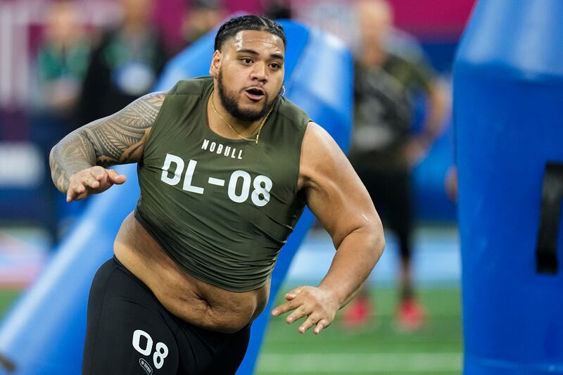 Baylor defensive lineman Siaki Ika runs a drill at the NFL scouting combine in 2023.