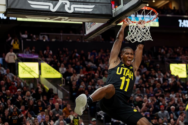 Utah Jazz guard Kris Dunn (11) dunks the ball on Monday, Jan. 1, 2024.
