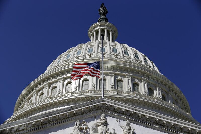 The American Flag flies at half staff on Capitol Hill in Washington, Tuesday, Sept. 11, 2012, before a Congressional remembrance ceremony for the events of 9/11. (AP Photo/Alex Brandon)
