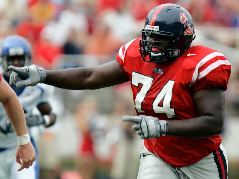 In this 2006 file photo, Mississippi tackle Michael Oher (74) gestures downfield during a college football game against Memphis.