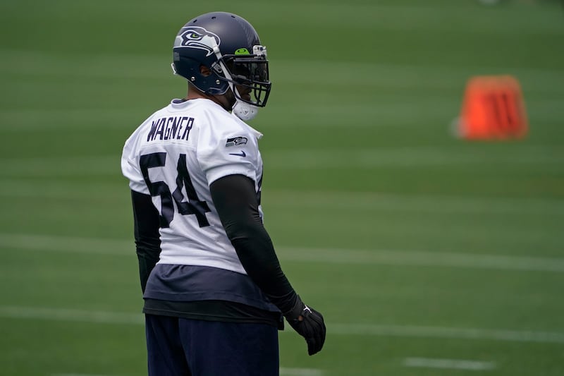 Seattle Seahawks middle linebacker Bobby Wagner stands on the field between drills.