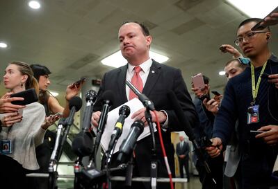 FILE - Sen. Mike Lee, R-Utah, pauses while speakings to members of the media after leaving a closed door meeting about Saudi Arabia, Wednesday, Nov. 28, 2018, on Capitol Hill in Washington.