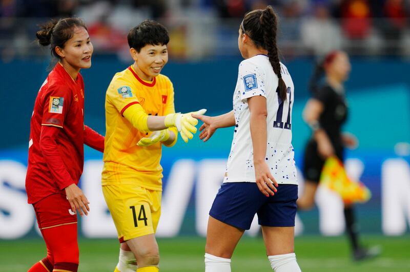 United States’ Sophia Smith (11) and Vietnam’s goalkeeper Thi Kim Thanh Tran shake hands after World Cup match.