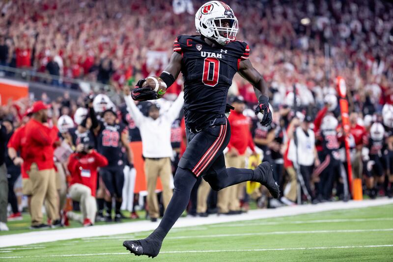 Utah linebacker Devin Lloyd returns an interception for a TD during Pac-12 championship game vs. Oregon at Allegiant Stadium.