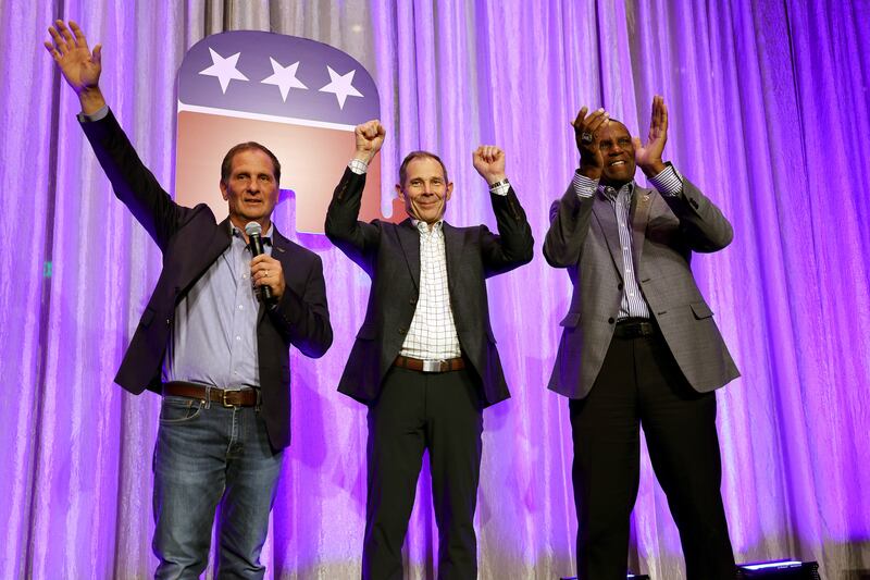 Utah Reps. John Curtis, from left, Chris Stewart and Burgess Owens take the stage at an election party at the Hyatt Regency in Salt Lake City on Nov. 8, 2022.