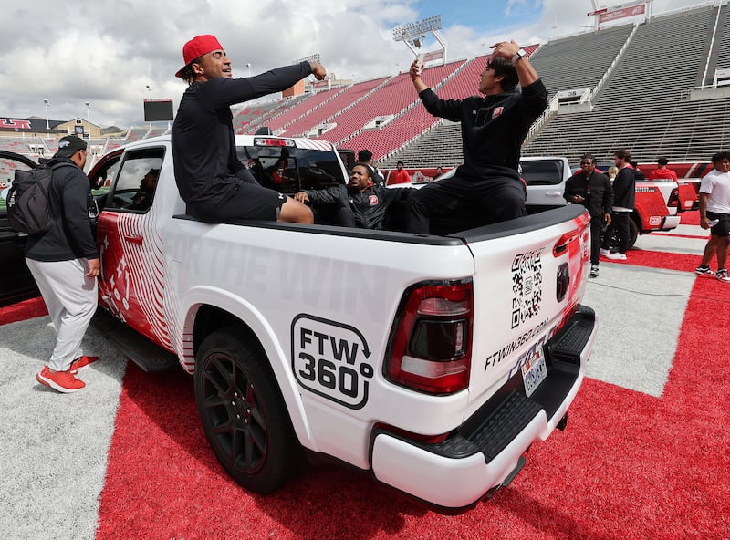 Utah Utes scholarship football players get in a truck as part of an NIL deal.