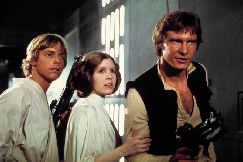 Luke Skywalker (Mark Hamill), Princess Leia (Carrie Fisher) and Han Solo (Harrison Ford) escape from the Death Star in “Star Wars: Episode IV A New Hope.”
