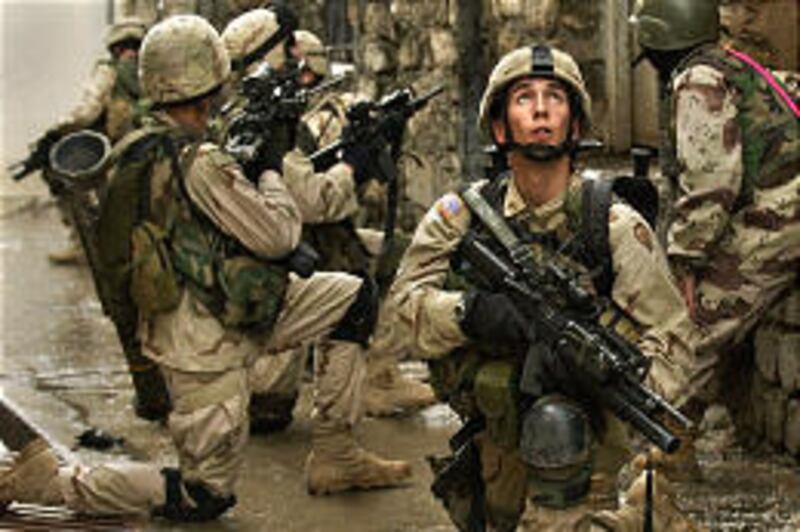 U.S. soldiers search for insurgents in Mosul, Iraq, on Monday. More insurgents are thought to be hiding in an area south of Baghdad.