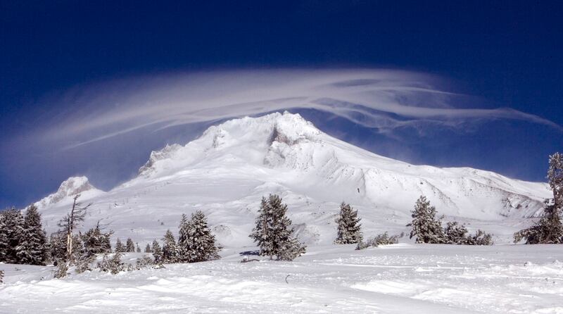 FILE - In this Dec. 13, 2009, file photo, a cloud forms over Mount Hood as seen from Government Camp, Ore. Researchers say active fault lines on Mount Hood could potentially trigger a 7.2 magnitude quake that could reach Portland. (AP Photo/Don Ryan, File)