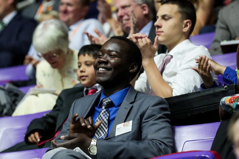 Hakeem Lubanga, of South Salt Lake, listens to a speaker during the Jehovah's Witnesses convention at the Dee Events Center in Ogden on Saturday, July 6, 2019.