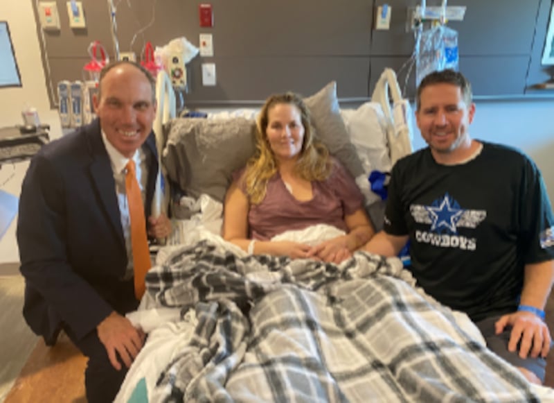 Elder Jon Schmitt, Deedra Russell and Troy Russell pose together as Deedra recovers from a head-on collision with a drunk driver.
