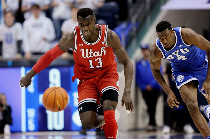 Utah center Keba Keita eyes ball after knocking it away from BYU forward Atiki Ally Atiki at the Marriott Center in Provo.