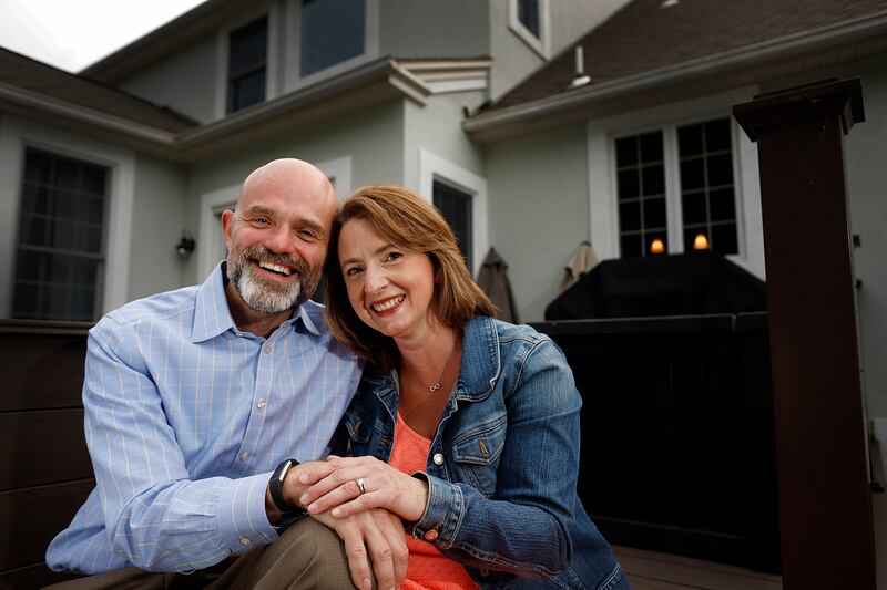 Christine Burke, 44, and her husband Jonathan Burke, 46, pictured in front of their Bethlehem, Pa., home, Wednesday, June, 12, 2019, have been married for 19 years and have two children. When they started having relationship issues they sought the help of