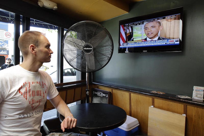 Jase Peeples watches a television broadcast of President Obama declaring his support of same-sex marriage Wednesday, May 9, 2012, at The Mix bar in San Francisco. President Obama today announced that he now supports same-sex marriage, reversing his longst